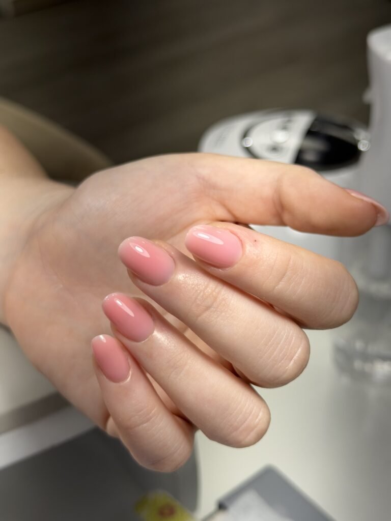 Soft blush almond manicure at a russian nail salon in Tampa, Florida by Nail Boss Studio with flawless cuticle work.