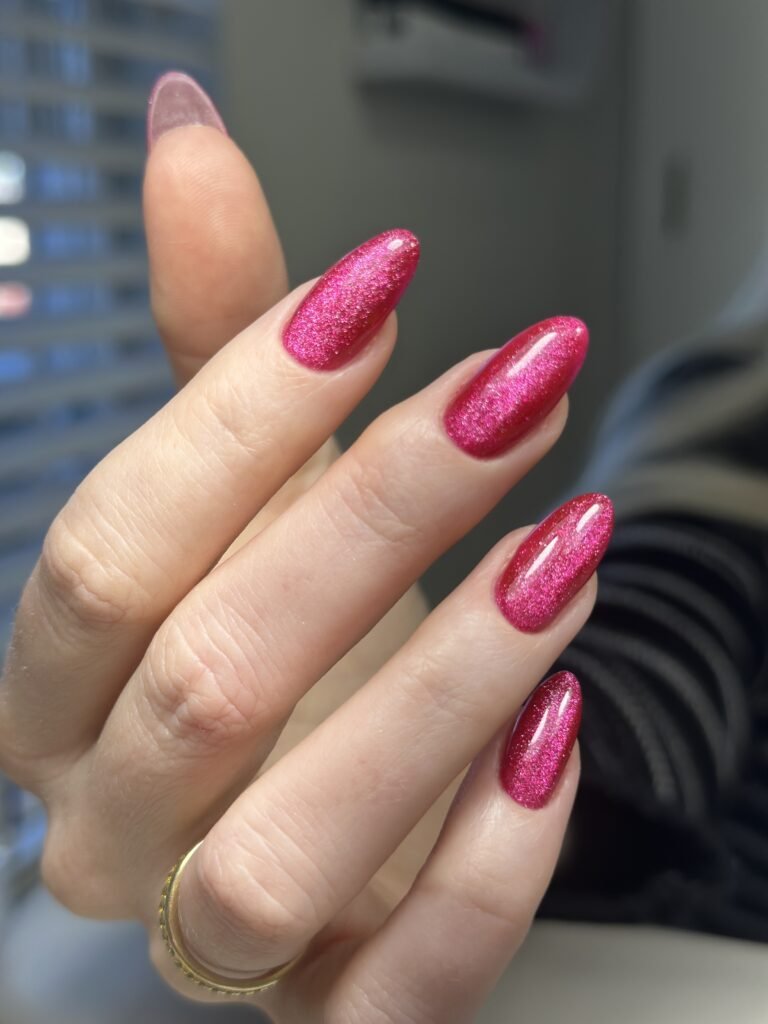 Sparkling pink builder gel manicure Tampa with almond-shaped nails created at Nail Boss Studio Tampa.
