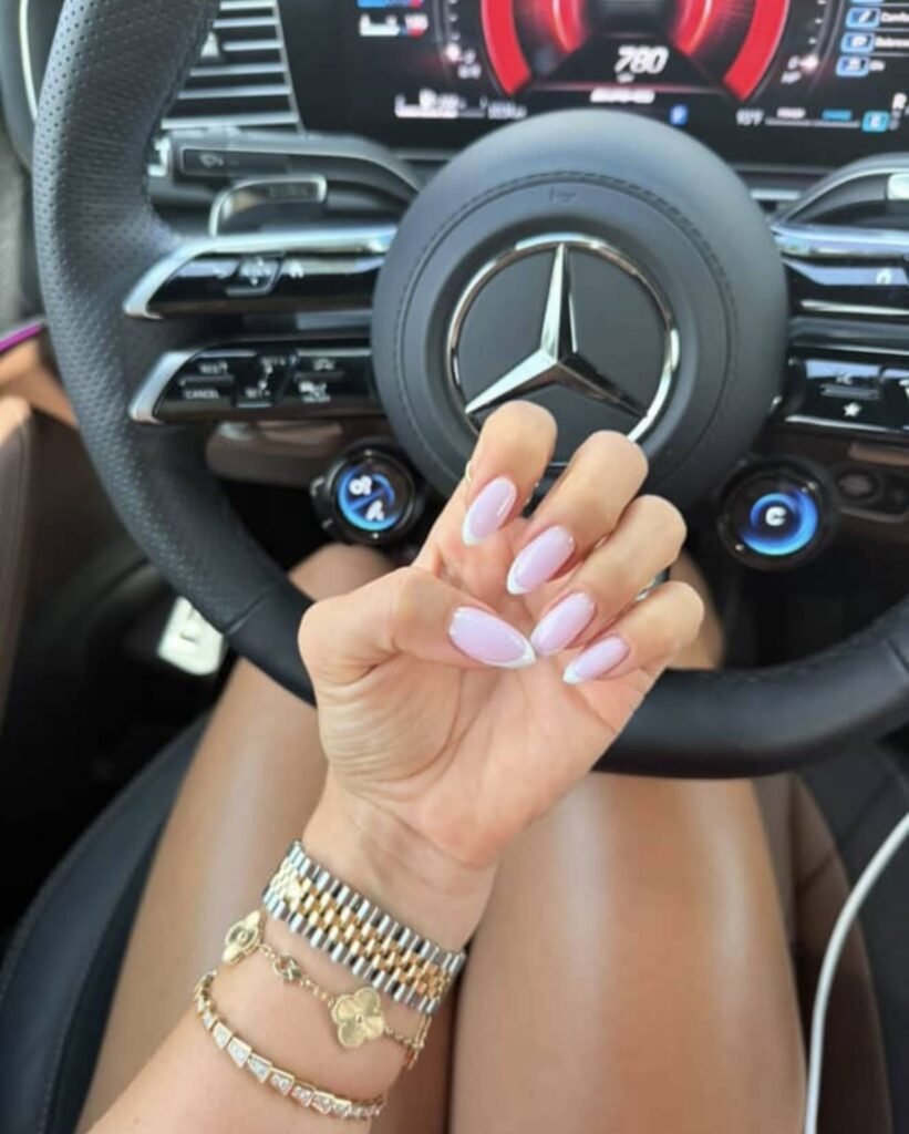 Soft lavender nails with european manicure near me in Tampa, Florida reflecting beautiful natural sunlight.