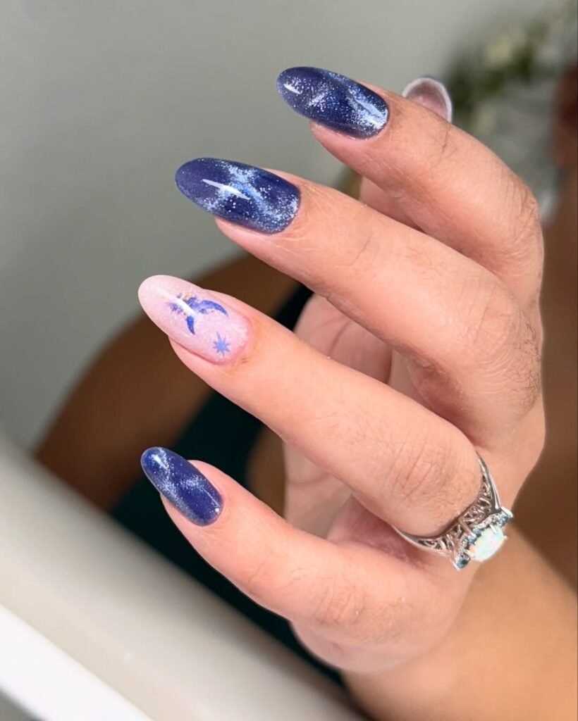 Elegant tampa russian nails with shimmering navy almond nails and delicate floral accent at Nail Boss Studio Tampa, Florida.