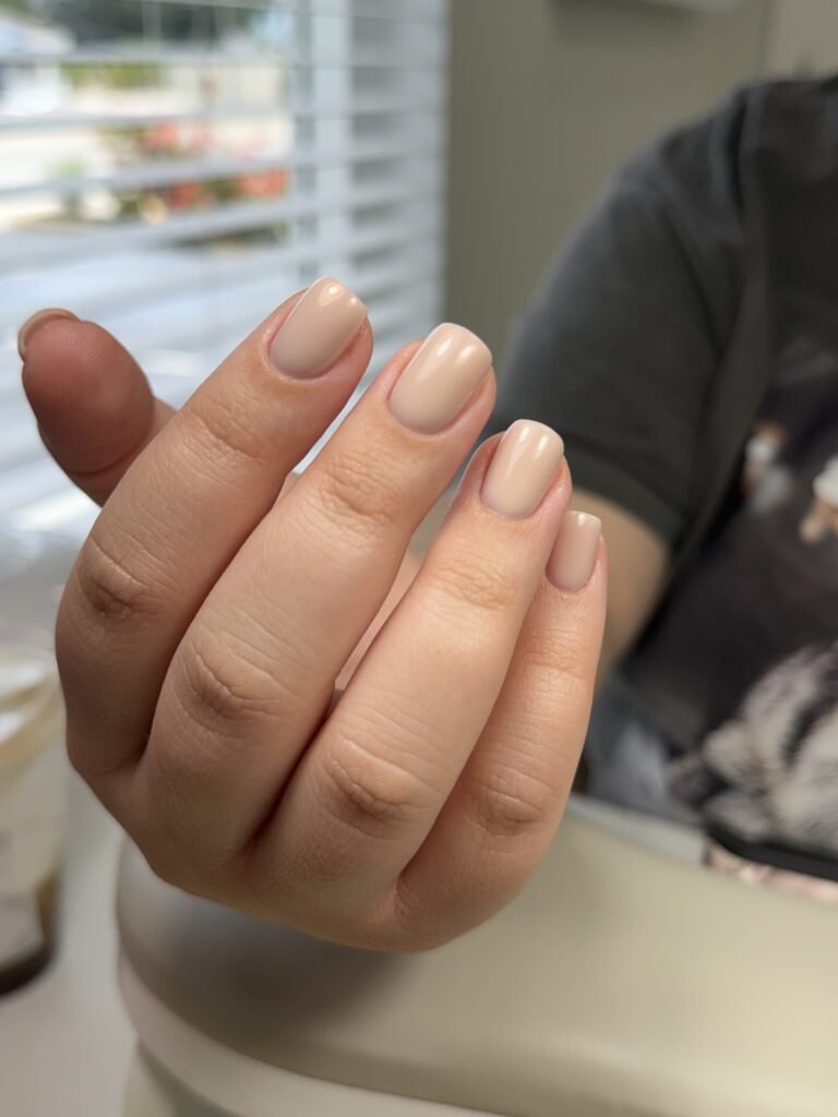 Elegant nude hard gel russian manicure on natural square nails in Tampa, Florida at Nail Boss Studio Tampa.
