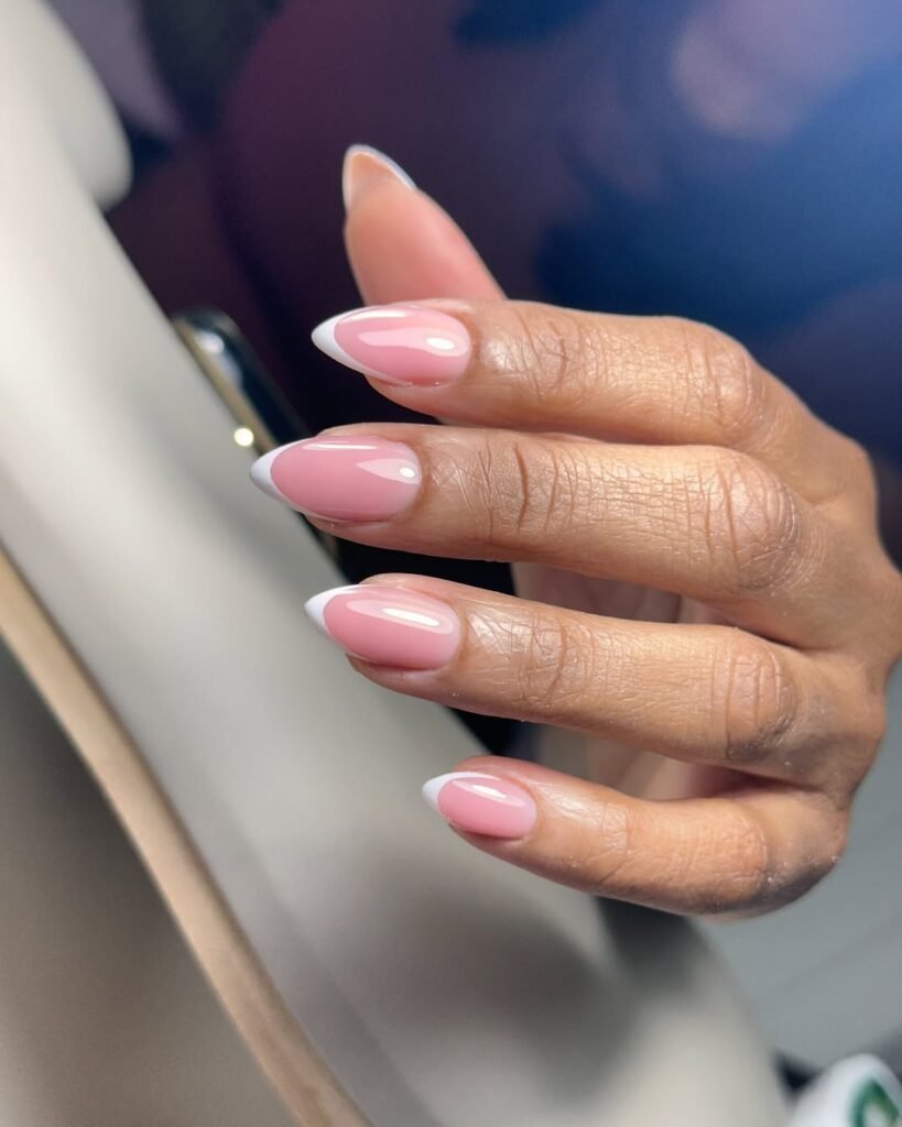 Elegant almond French manicure at russian nail salon near me in Tampa, Florida by Nail Boss Studio.