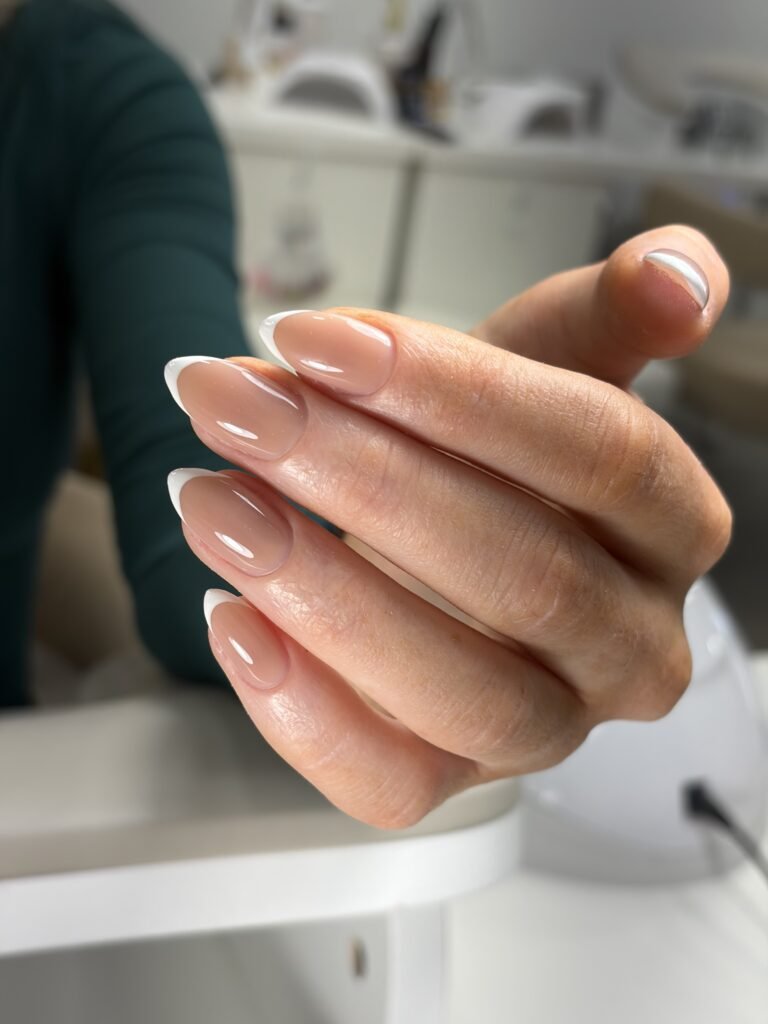Close-up of beige builder gel manicure finished at Nail Boss Studio Tampa