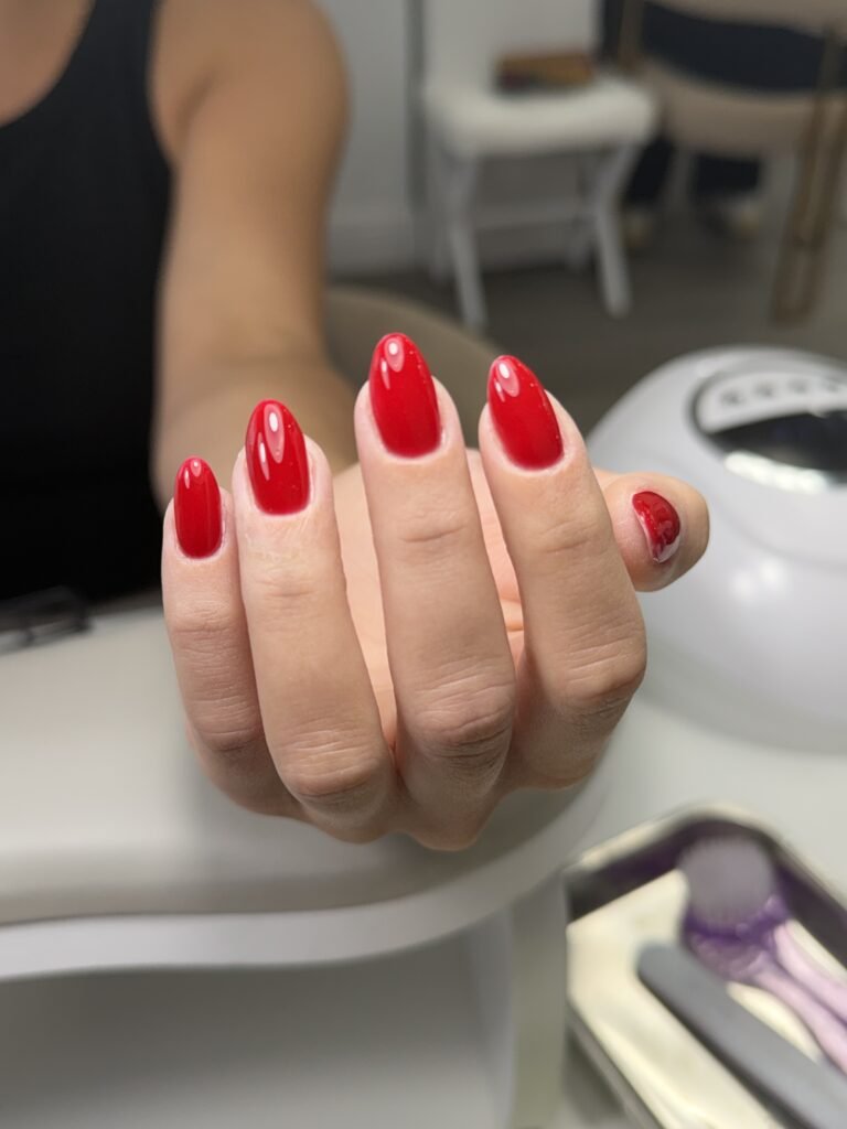 Elegant glossy red nails featuring builder gel manicure Tampa at Nail Boss Studio Tampa, Florida.