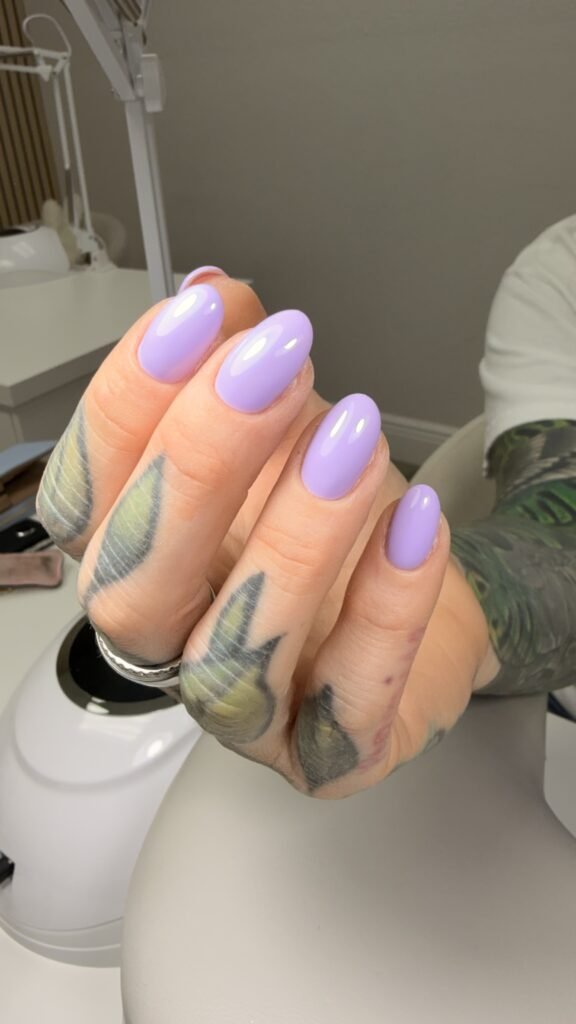 Soft lavender russian nails with an elegant almond shape at Nail Boss Studio in Tampa, Florida.