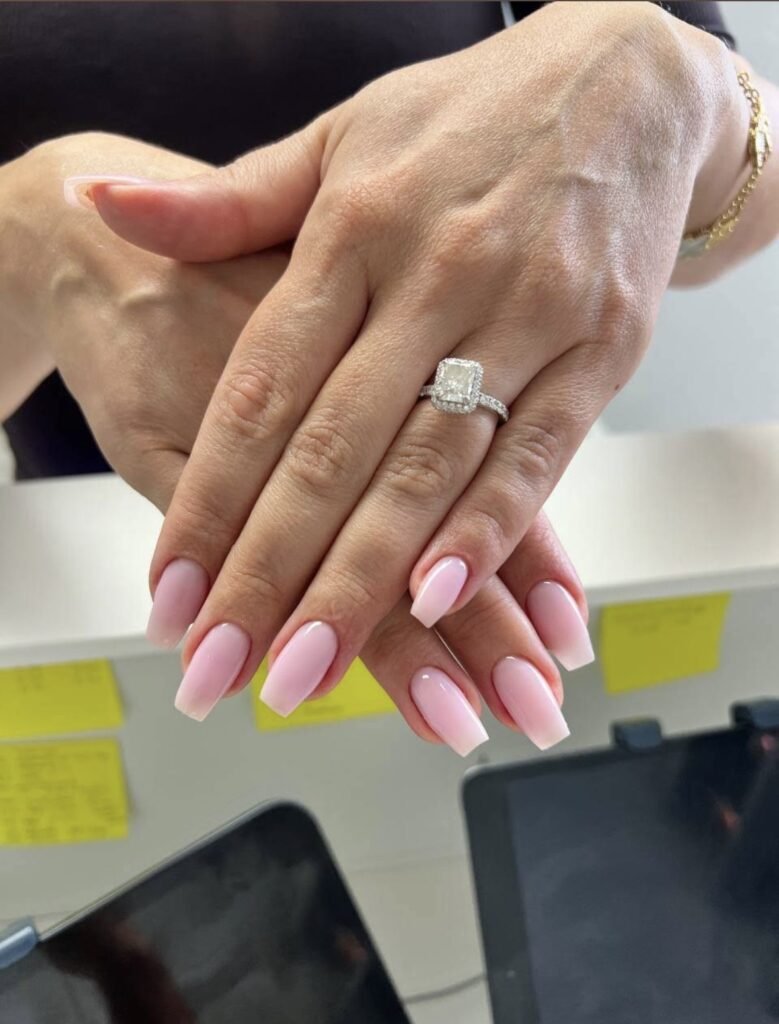 Classic glossy red almond nails featuring builder gel Tampa at Nail Boss Studio in Tampa, Florida.