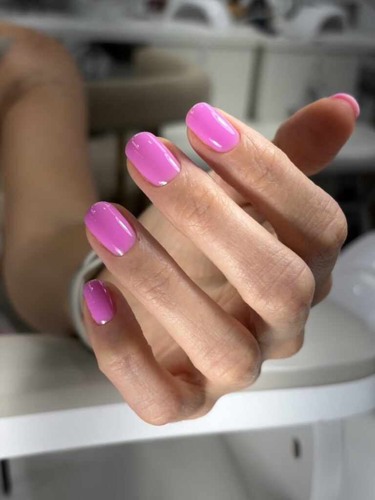 Close-up of beige russian nail salon near me finished at Nail Boss Studio Tampa