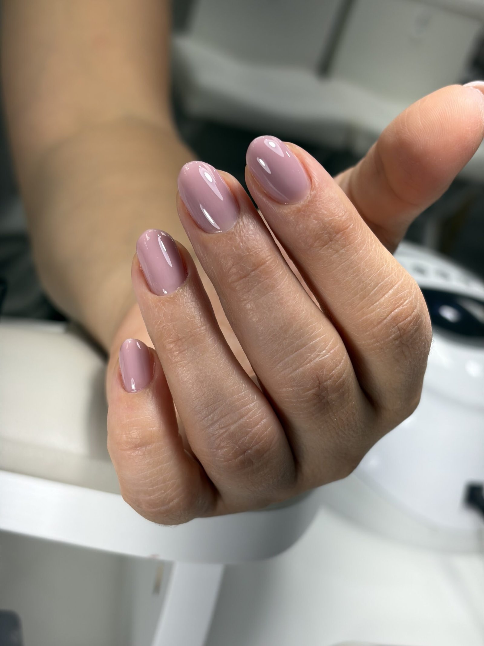Close-up of beige russian nails finished at Nail Boss Studio Tampa