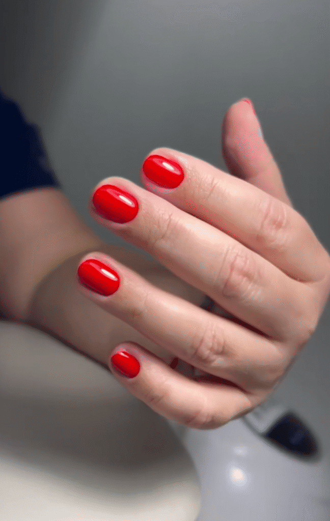 Classic glossy red russian nails tampa manicure with clean cuticles at Nail Boss Studio in Tampa, Florida.