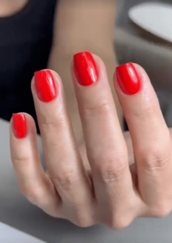 Glossy red nails featuring builder gel Tampa at Nail Boss Studio Tampa, Florida with a clean luxury finish.
