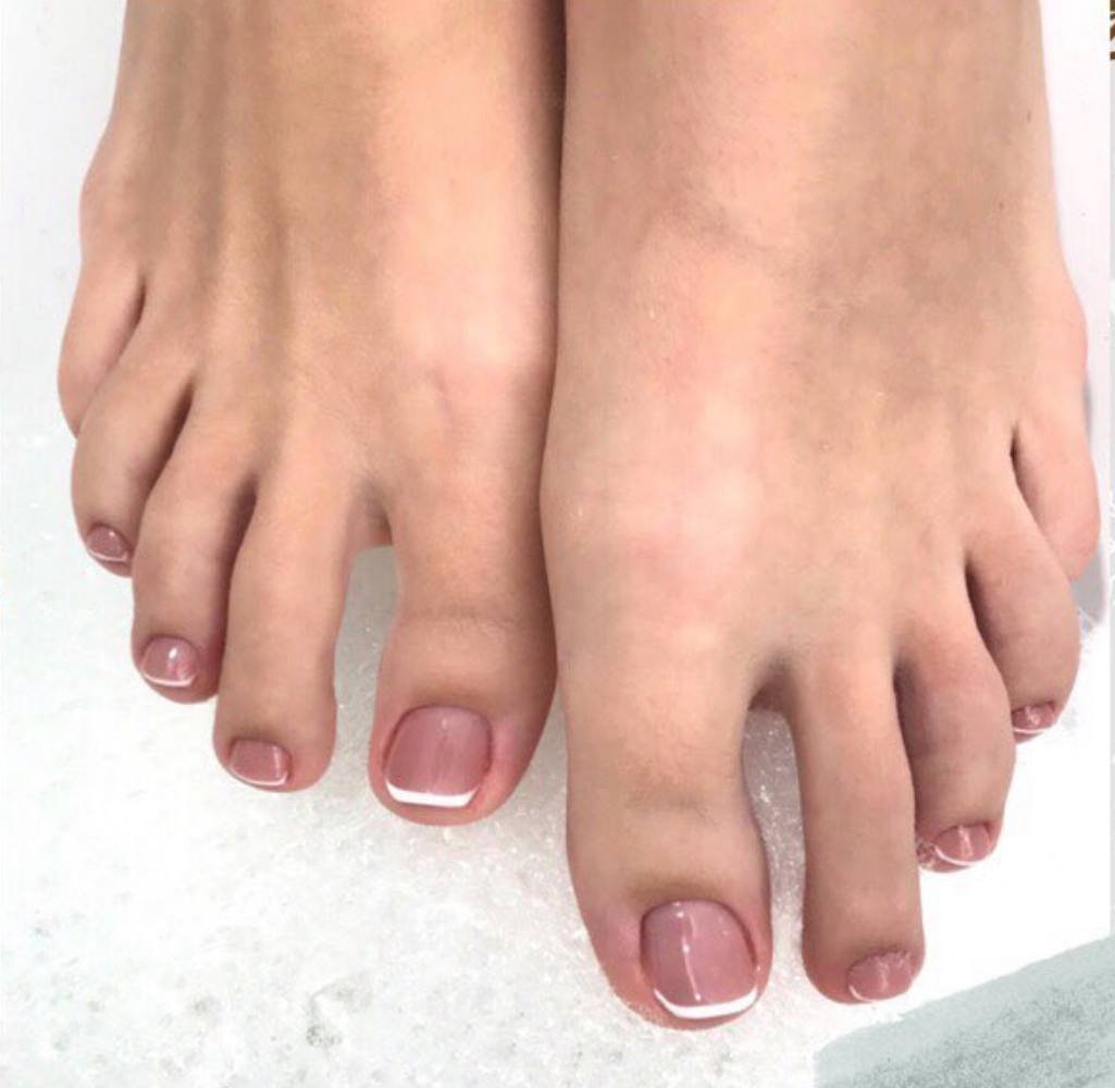 Close-up of beige smart pedicure near me finished at Nail Boss Studio Tampa