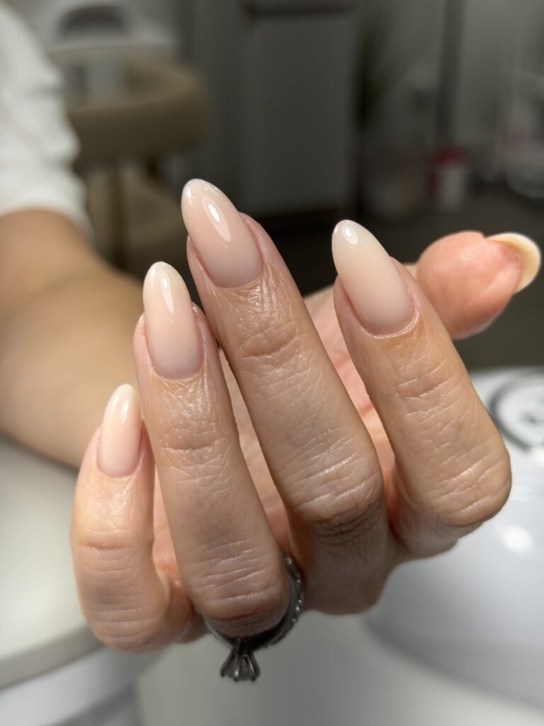 Elegant russian manicure tampa with soft nude almond nails at Nail Boss Studio Tampa, Florida.