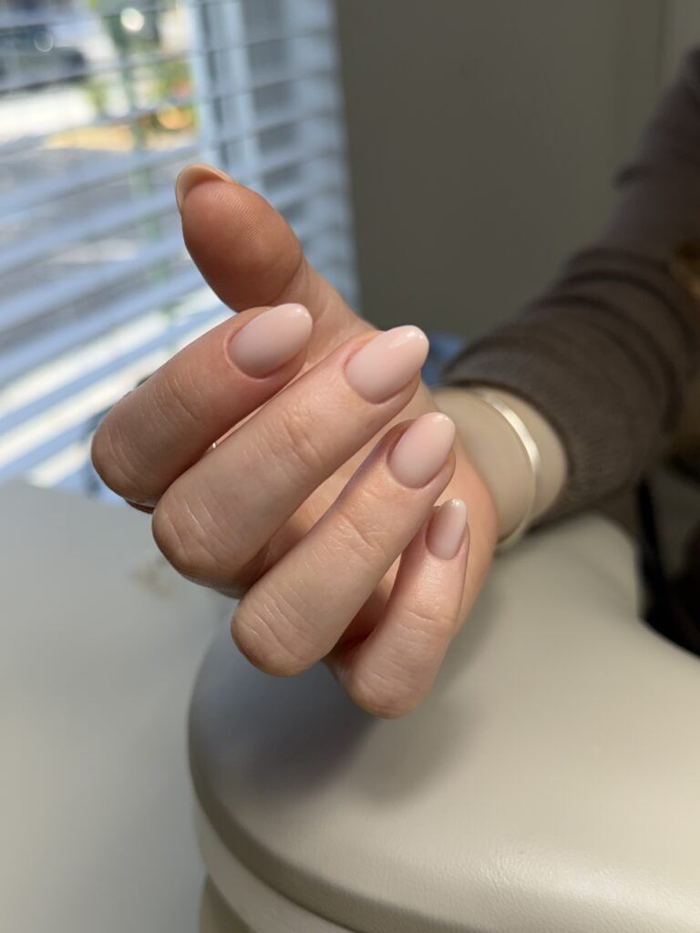 Soft blush hard gel russian manicure on short oval nails at Nail Boss Studio Tampa, Florida.