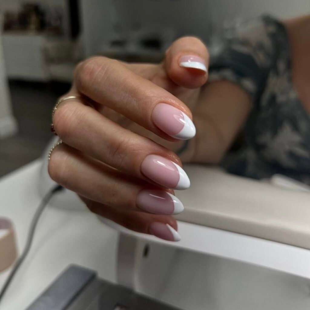 Elegant almond French nails with russian manicure near me styling at Nail Boss Studio Tampa, Florida.