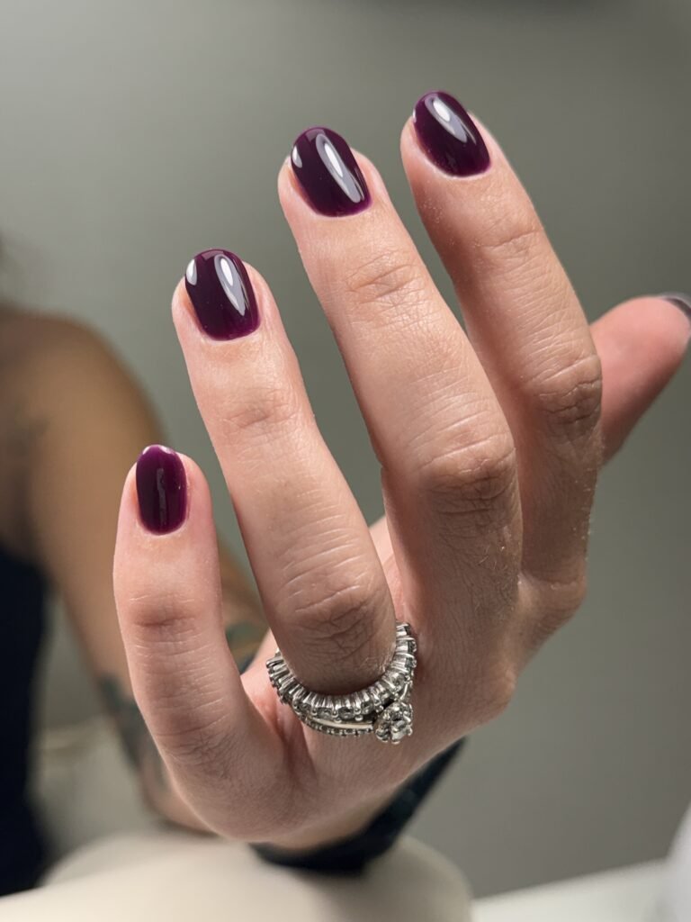 Deep plum russian manicures near me on short oval natural nails at Nail Boss Studio Tampa, Florida.