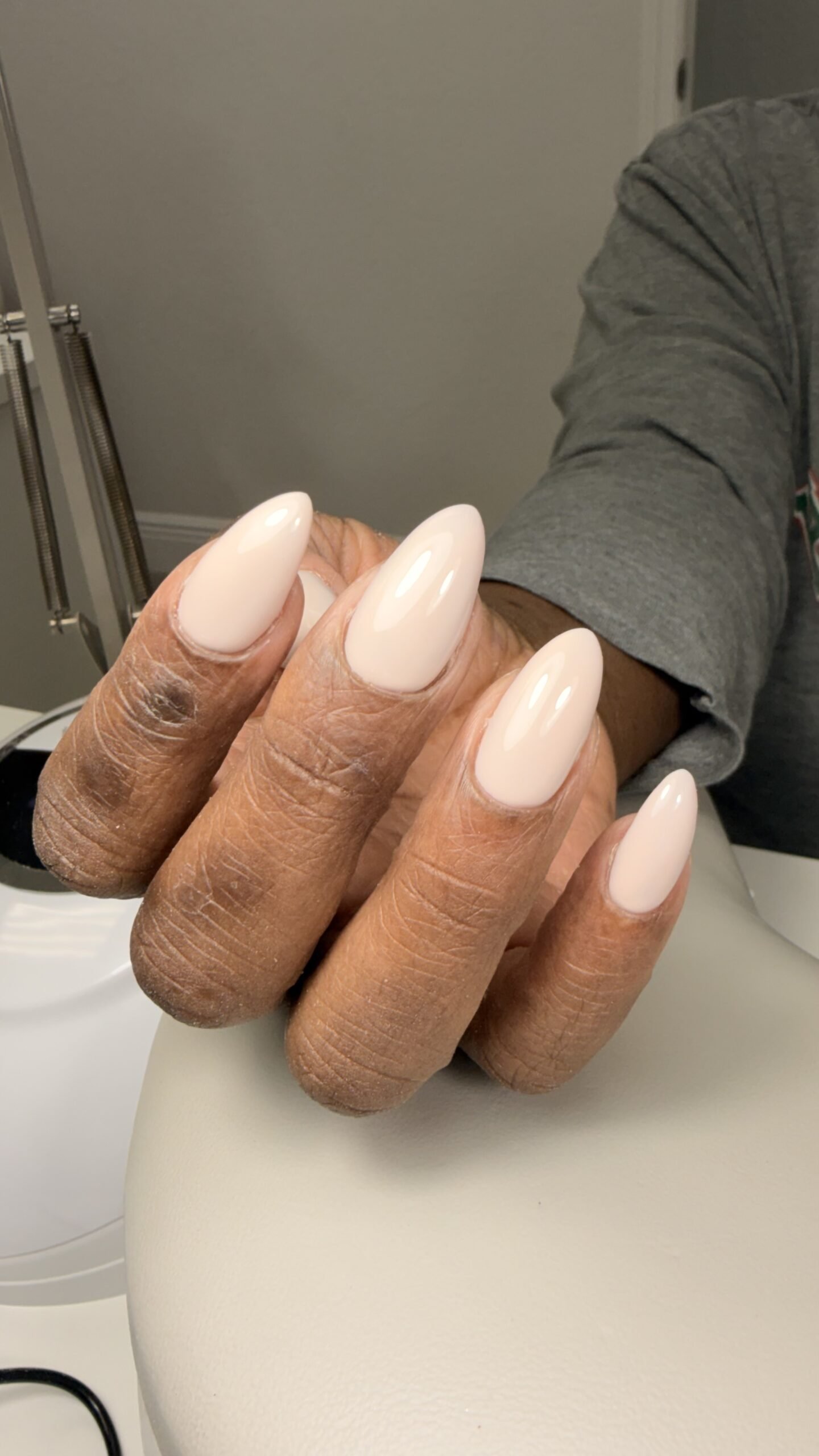 Close-up of champagne dry manicure finished at Nail Boss Studio Tampa