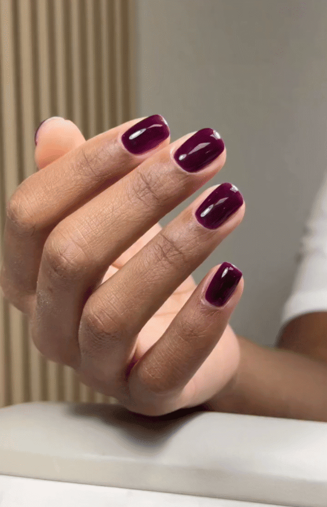 Deep plum russian manicure with short soft square nails and a glossy finish at Nail Boss Studio in Tampa.