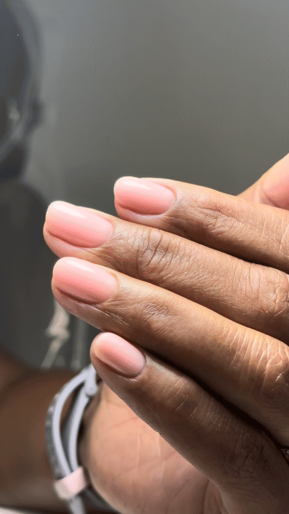 Soft pink glossy nails with russian manicures Tampa styling, elegant rounded shapes and precise detailing at Nail Boss Studio.